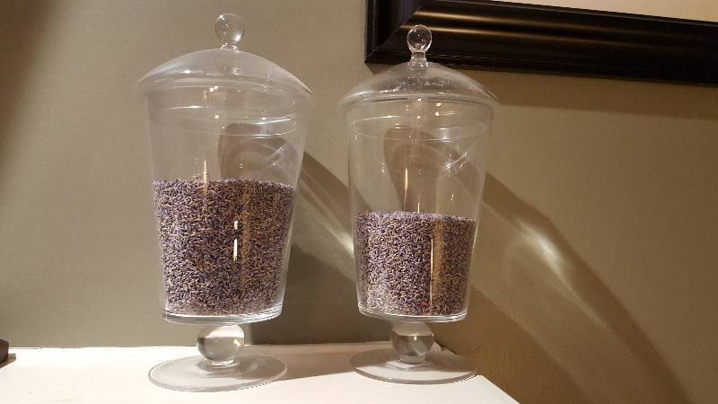 lot 1038 image: (2) glass jars filled with lavender...