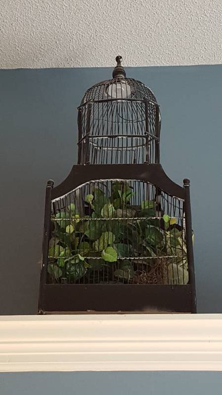lot 1084 image: Wooden bird cage and greenery