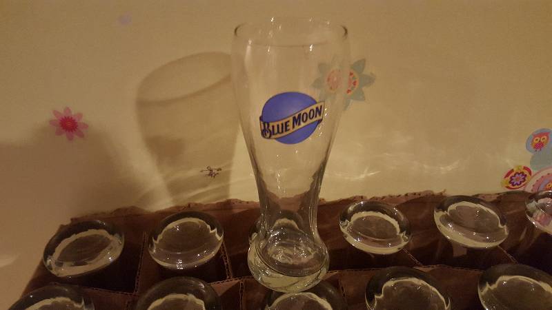 lot 1111 image: Lot of (24) Blue Moon Pilsner glass...