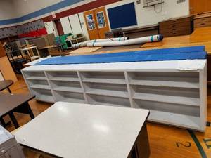 lot 248 image: White Storage Shelf with four 3 shelf compartments 12 ft 6in x 35 in