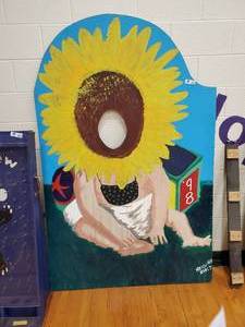 lot 365 image: Baby Sun Flower  Face in the hole Board
