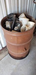 lot 7431 image: 55 Gallon metal barrel of Drainage pipe & parts