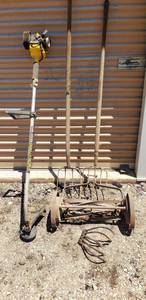 lot 9312 image: Pitch Forks, trimmer for parts, old mower blade Reel, tiller