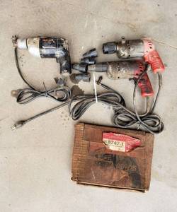 lot 1099 image: (2) Milwaukee Heavy Duty Reversing Drywall Screwdrivers and Black and Decker 12 Drill