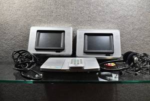 lot 2042 image: Trutech Two Screen Mobile DVD System  Includes Remote, One Pair of Headphones, & Home and Car Power Cables  ONLY ONE SCREEN WORKS -WILL SHIP