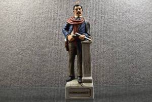 lot 2081 image: American Porcelain McCormick Distilling Company  Doc Holliday  Whiskey Botttle Limited Edition  13 Tall  -WILL SHIP