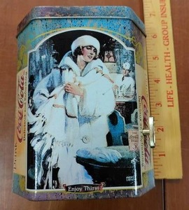 lot 2095 image: Coca-Cola Music Box Tin  Woman With White Fur Coat  Enjoy Thirst  6H x 5W x 3.25D -WILL SHIP