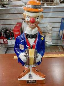 lot 2107 image: Ezra Brooks 1971 Clown with Accordian Decanter  14 12 Tall -WILL SHIP