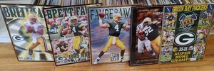 lot 2172 image: Lot of 5 Framed Green Bay Packers Posters  Includes 1995 MVP Brett Favre, Superbowl Champions 1997, & Do I Hear Footsteps  Reggie White  16 x 20 -WILL SHIP