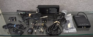 lot 2197 image: Large Lot of Small Electronic Items  Shure Prologue Corded Microphone, Panasonic AV Line Adaproe VW-KMS1, Realistic Pro-30 16 Channel Scanner, Various Cords and Adapters -WILL SHIP