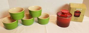 lot 2000 image: Le Creuset Red Butter Crock and 5 Green Custard Ramekins