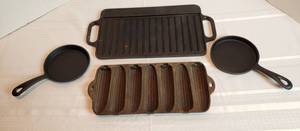 lot 2017 image: 4 Cast Iron Cook Ware  Victoria 2 Side Griddle, 2 One Egg Skillets and Corn cob Mold