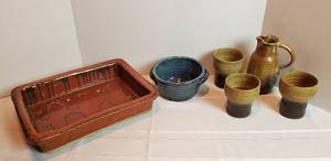 lot 2022 image: Custom Made Pottery Cookware  12 x 9 in. Pan, 6 in. Blue Bowl and TanBrown PitcherCup Set (1 cup small chip)