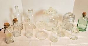 lot 2030 image: Glass Jars and Bottles  most with lids or stoppers