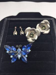 lot 1039 image: Vintage Jewelry - Blue Rhinestone Butterfly, Silvertone Flower clip back earrings with Peridot stones, Topaz post earrings