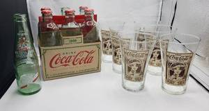 lot 1227 image: 6 Reproduction Flair Coca-Cola Glass, Reproduction 1899 Coca-Cola 6-pack Bottles(c2007) and WSU Dr. Pepper Bottle (c1995)