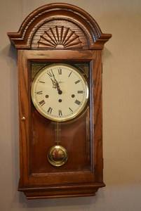 lot 2002 image: Howard Miller Wood Clock w. Key and Manual