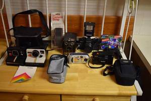 lot 2071 image: Lot of Vintage Cameras -Two Polaroid Land Cameras, Brownie, Sony SureShot, Vivitar, & Tasco Binoculars