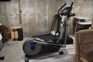 lot 2206 image: XP 115 Elliptical Trainer Exercise Equipment -In basement. Bring help to load.