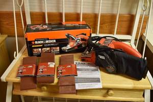 lot 2223 image: Black & Decker Belt Sander w. Sandpaper -Very Good Condition