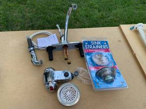 lot 2294 image: Delta Faucet, Sink Strainer, & Water Filter