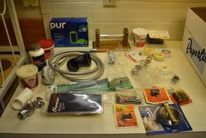 lot 2315 image: Lot of Plumbing Repair Items -PUR filters, fittings, Showerhead, hose, putty &amp More