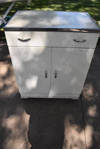lot 2349 image: Mid Century Metal Cabinet. On cart with casters.