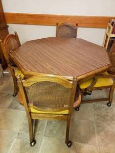 lot 2035 image: 4 Hexagonal Dinner Table on Casters w. Chairs on casters - One Chair is Missing Cover Material