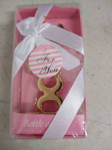 lot 6208 image: gold baby bottle opener