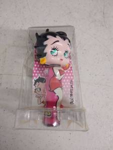 lot 6282 image: One Betty Boop Candy Lip Gloss And Statute, ,6 Oz. In Package