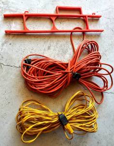 lot 166 image: 2  50 ft Extension Cords & Holder
