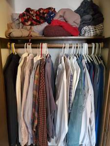 lot 5344 image: Lot of Men Clothws. on Shelf and Bar