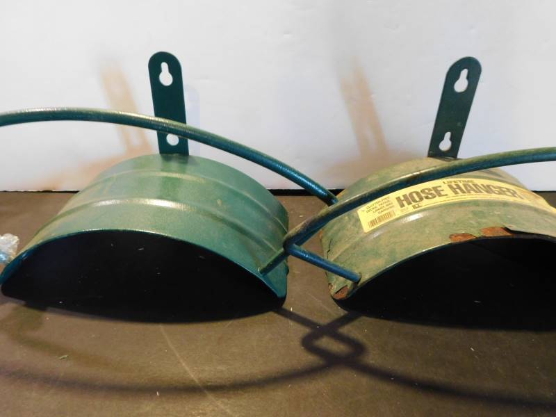 lot 1514 image: Garden Hose Hangers (2 ea)