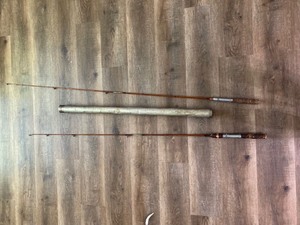 lot 2029 image: Pair of Vintage Wooden Fishing Poles with Cork Handles in metal tube