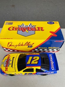 lot 2087 image: Gray bar Limited addition 124 stock car Kenny Wallace 1997 Thunderbird bank