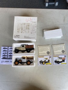 lot 2097 image: 1934 Ford steak fence truck New Haven and a 1932 Chevy pick up Butler��s diecast