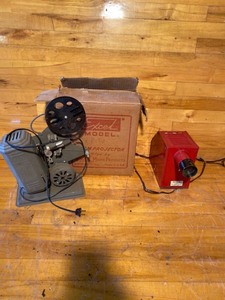 lot 2114 image: Vintage XL 16 mm movie projector and magna view projector
