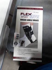 lot 3377 image: FLA Orthopedics Flex-Light Hinged Ankle Brace  - Size Large