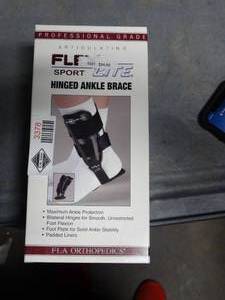 lot 3378 image: FLA Orthopedics Flex-Light Hinged Ankle Brace  - Size Medium