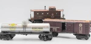 lot 4142 image: Lionel Trains No. 6454 P.R.R. Box Car, No. 6457 Caboose and No. 6555 Sunoco Tank Car - All in Original Boxes