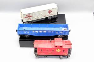 lot 4224 image: Lionel Train O Scale Trains (3), Santa Fe Caboose 9061, Republic Steel 9136, and Erie Lackawanna 9043