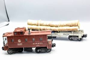 lot 4229 image: Lionel Train O Scale Vintage Brown Caboose with Smoke Stack 6457 and Lionel Lines Wood hauler 336155
