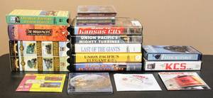 lot 4300 image: 19 Piece Lot of Train Related VHS Collections and CDs - Collectors Choice Set (Steam Giants and Steam in the 50s), Great Train Journeys of Australia, Railroad Songs CDs and Interactive DVDs on train layouts ... plus more