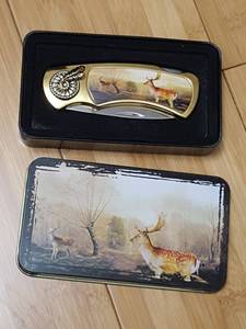 lot 7074 image: Knife in tin