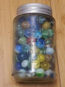 lot 7106 image: Approximately 125 marbles in Pint jar