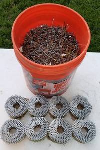 lot 4102 image: 5 gallon bucket full of nails and rolls of siding nails