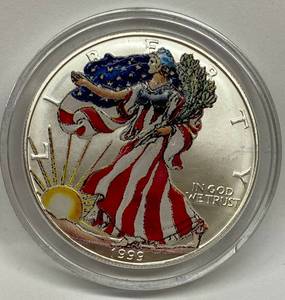 lot 1604 image: 1999 American Eagle Silver Dollar - Painted and Collectible