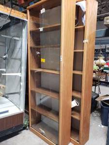lot 3686 image: Tall wood glass front bookshelf display case
