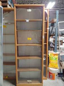 lot 7236 image: Tall glass front bookshelfshowcase. 2 glass doors