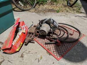 lot 105 image: 1 12 Ton Scissor Jack And Craftsman Electric Hand Saw